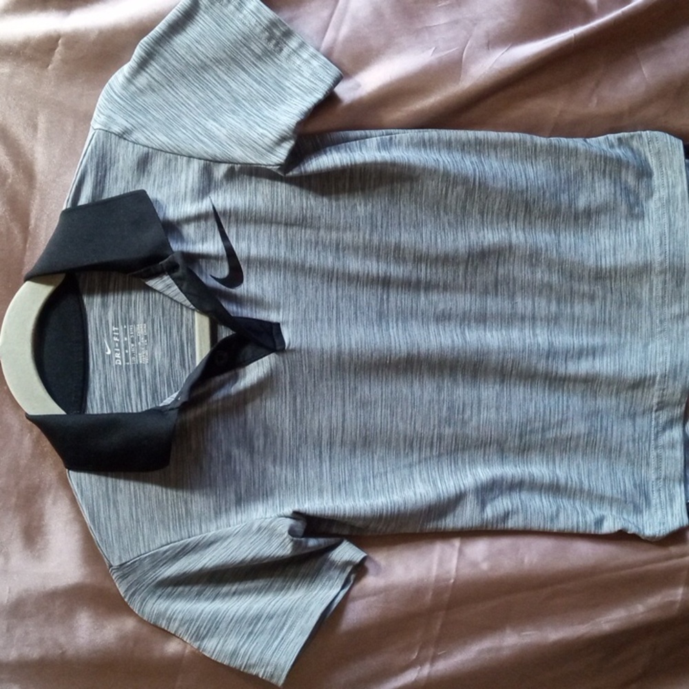Nike kids medium dri-FIT grey polo shirt with black collar and swoosh.